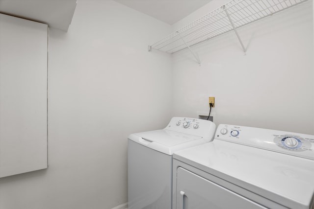 laundry area featuring washing machine and dryer and laundry area