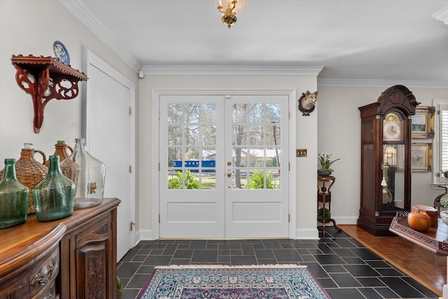 foyer with french doors, crown molding, and baseboards