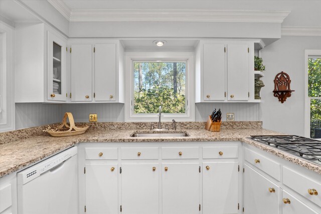 kitchen featuring a sink, dishwasher, and white cabinets