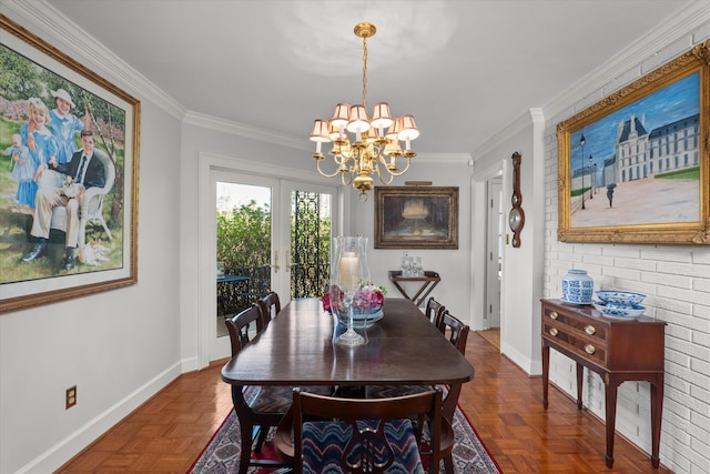 dining area with an inviting chandelier, crown molding, and baseboards