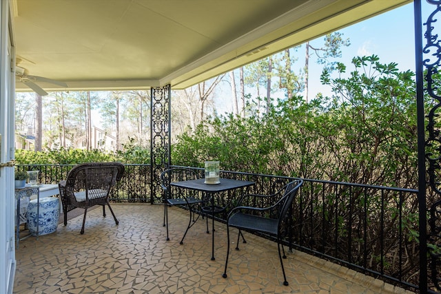 sunroom with a ceiling fan