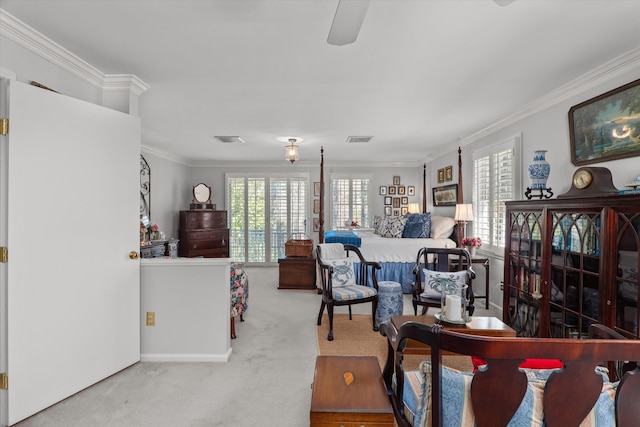 living room featuring crown molding, plenty of natural light, carpet, and visible vents