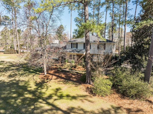 back of house with a yard