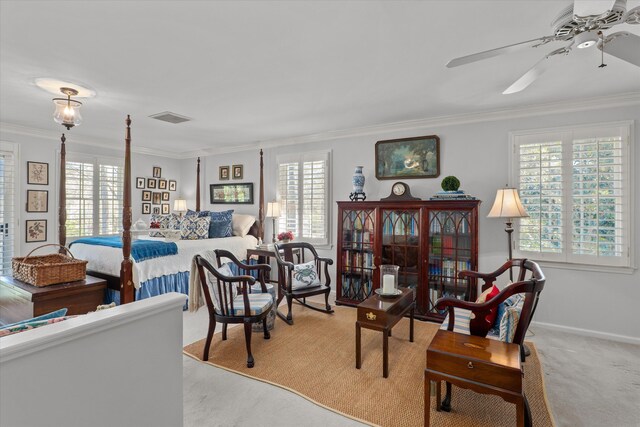 bedroom with multiple windows, visible vents, and ornamental molding