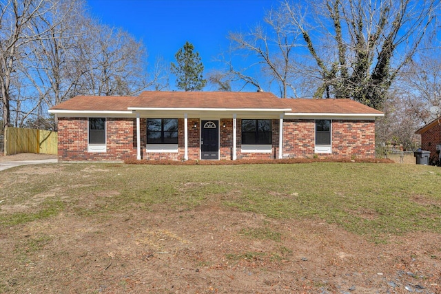 ranch-style house with brick siding, a front yard, and fence