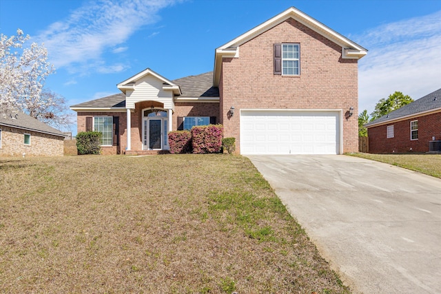 traditional home featuring a front yard, brick siding, driveway, and an attached garage