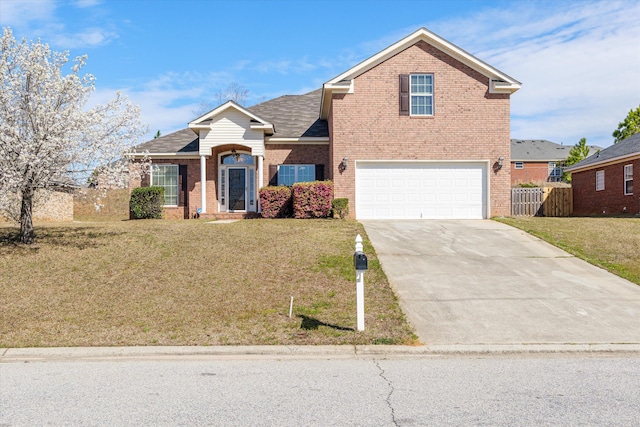 traditional-style house featuring driveway, a front yard, fence, and brick siding