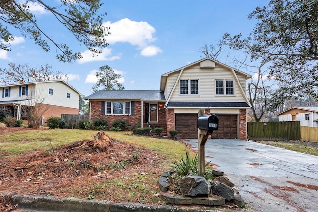 tri-level home with a front yard and a garage