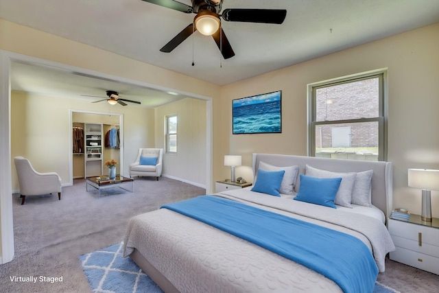 bedroom featuring carpet floors, a closet, a ceiling fan, and baseboards