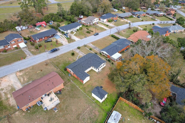 birds eye view of property with a residential view