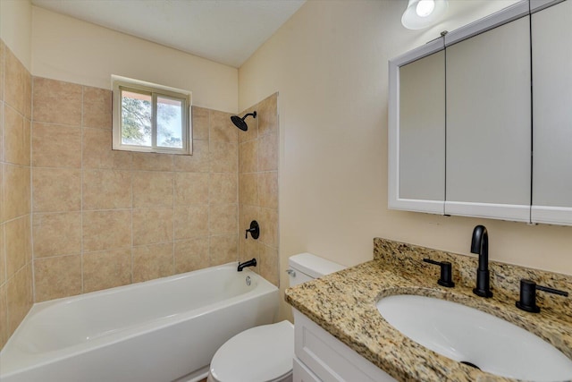 full bathroom featuring washtub / shower combination, vanity, and toilet