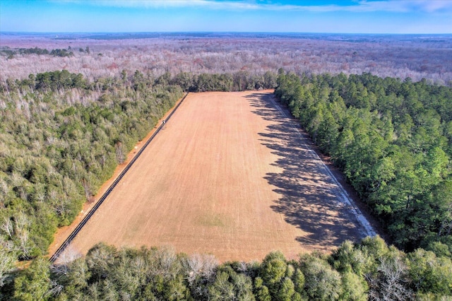 aerial view featuring a rural view and a view of trees