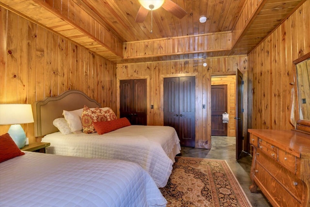 bedroom featuring wooden ceiling, a raised ceiling, and wood walls