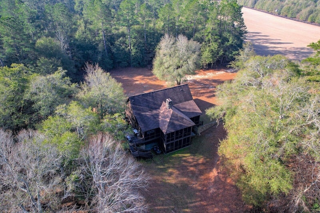 aerial view featuring a wooded view