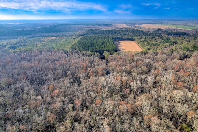 birds eye view of property with a forest view