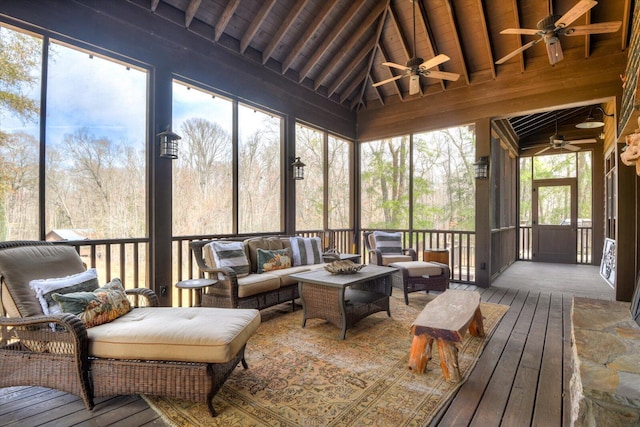 sunroom / solarium featuring wooden ceiling, vaulted ceiling with beams, and ceiling fan