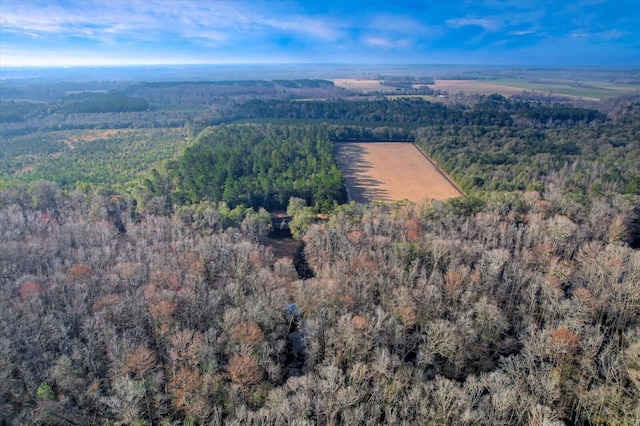 bird's eye view featuring a wooded view