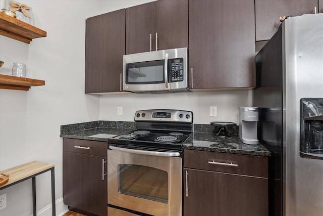 936 Broad St # 415, Augusta, GA 30901 - kitchen with dark stone countertops, stainless steel appliances, open shelves, and dark brown cabinetry