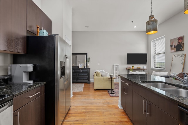 936 Broad St # 415, Augusta, GA 30901 - kitchen with light wood-type flooring, open floor plan, dark brown cabinetry, and a sink