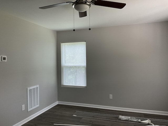 spare room with ceiling fan and dark hardwood / wood-style floors