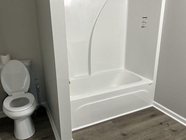 bathroom featuring hardwood / wood-style flooring and toilet