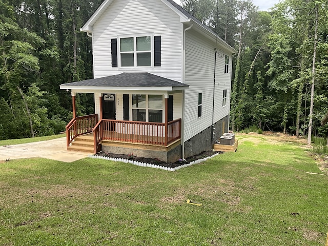 view of front of house with covered porch and a front yard