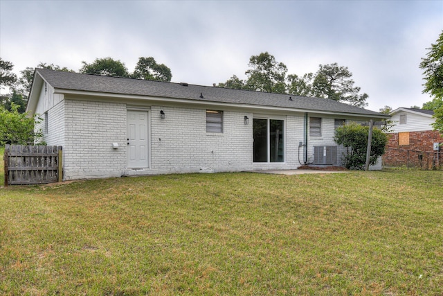 2505 Blackstone St, Augusta, GA 30906 - back of house featuring a lawn, brick siding, central AC, and fence