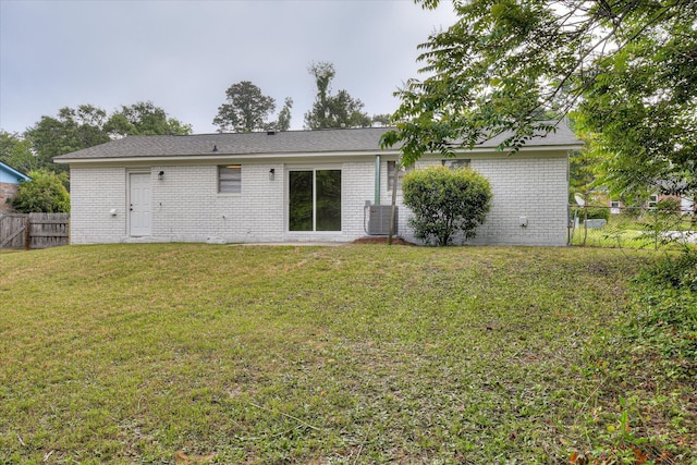2505 Blackstone St, Augusta, GA 30906 - rear view of house featuring fence, cooling unit, a lawn, and brick siding