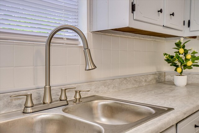 2505 Blackstone St, Augusta, GA 30906 - interior details featuring a sink, white cabinetry, and light countertops