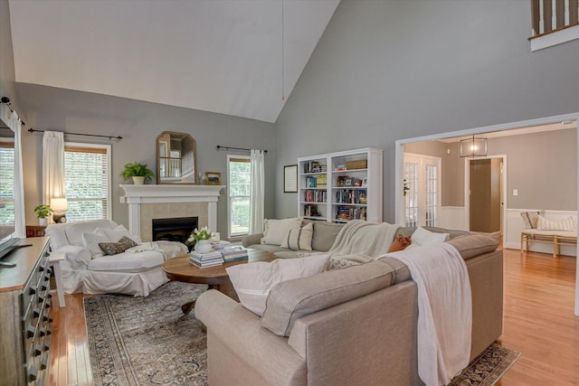 207 Oleander Trl, Evans, GA 30809 - living room with light wood-style flooring, high vaulted ceiling, healthy amount of natural light, and a fireplace