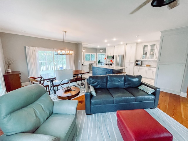 228 Heron Shrs, Mccormick, SC 29835 - living area with light wood finished floors, ceiling fan with notable chandelier, baseboards, and recessed lighting