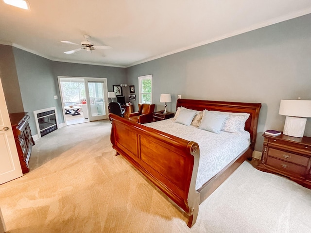 228 Heron Shrs, Mccormick, SC 29835 - bedroom featuring a fireplace, ornamental molding, access to outside, and light colored carpet