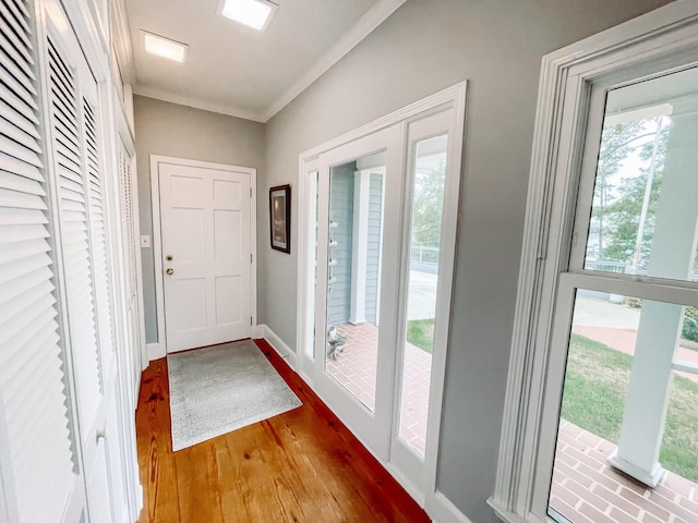 228 Heron Shrs, Mccormick, SC 29835 - entryway featuring ornamental molding, baseboards, and wood finished floors