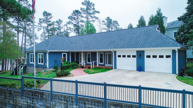 228 Heron Shrs, Mccormick, SC 29835 - ranch-style home with concrete driveway, a garage, fence, and a shingled roof