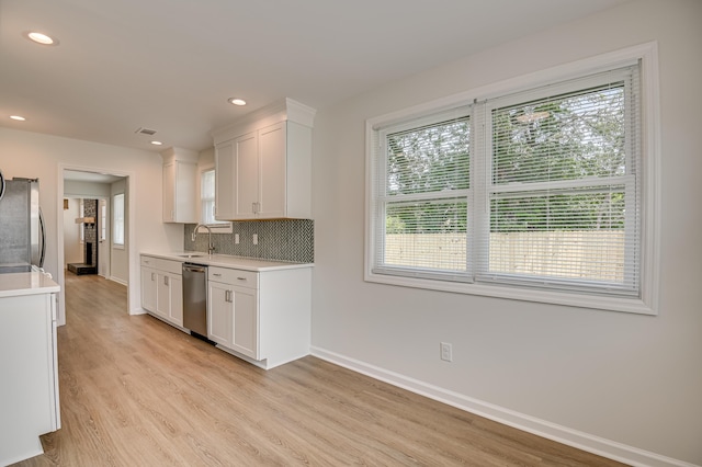 4075 Flintrock Way, Martinez, GA 30907 - kitchen featuring appliances with stainless steel finishes, light countertops, light wood-style flooring, white cabinetry, and recessed lighting