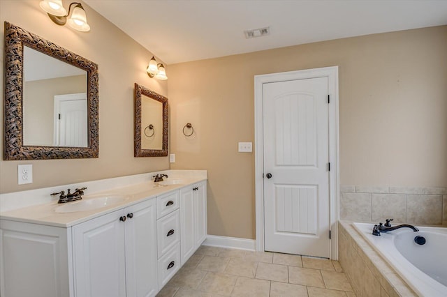 bathroom with tile patterned flooring, visible vents, a sink, and double vanity