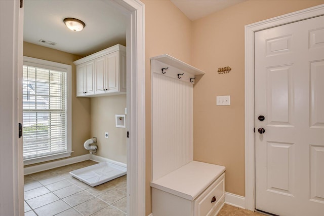 mudroom with visible vents, baseboards, and light tile patterned flooring