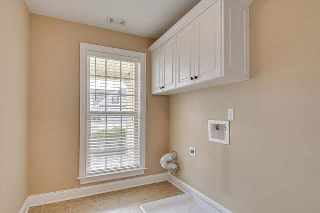 laundry area with cabinet space, visible vents, baseboards, hookup for an electric dryer, and washer hookup