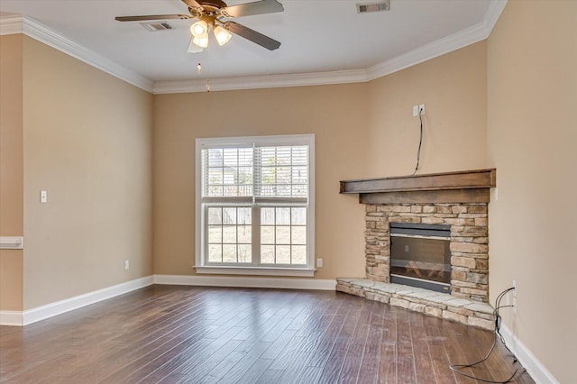 unfurnished living room featuring ornamental molding, visible vents, baseboards, and wood finished floors