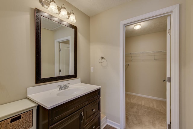 bathroom featuring vanity and a textured ceiling