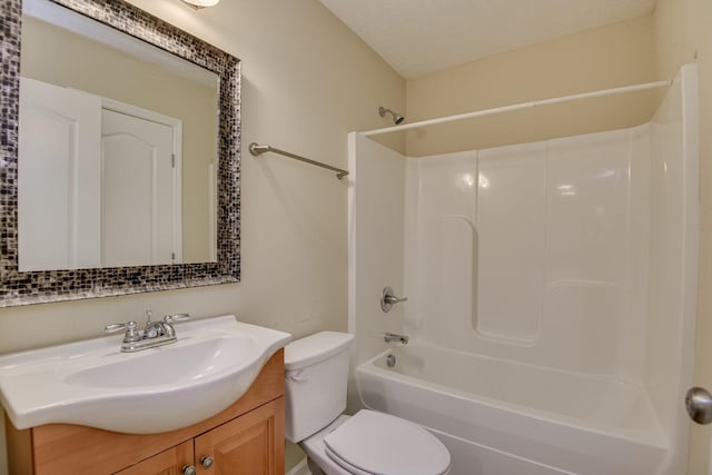 full bathroom featuring vanity,  shower combination, toilet, and a textured ceiling