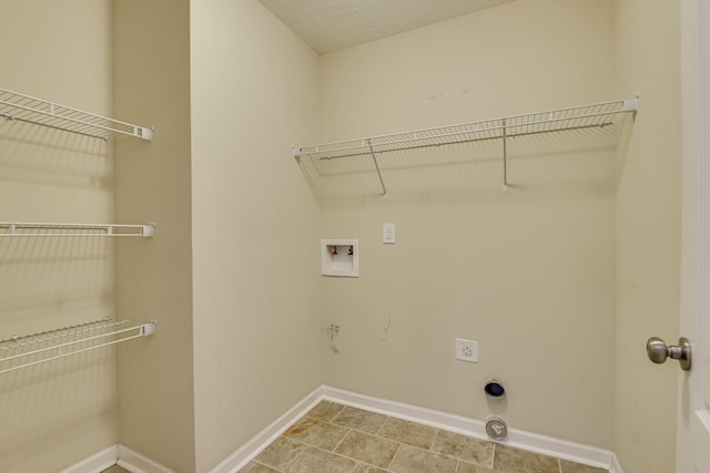 clothes washing area with hookup for a washing machine and hookup for an electric dryer