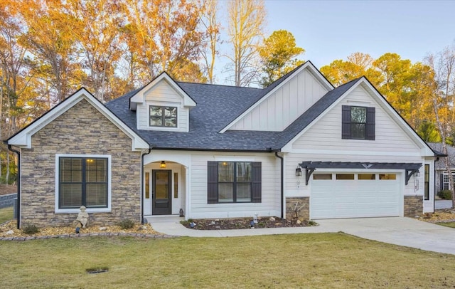 view of front facade with a garage and a front lawn