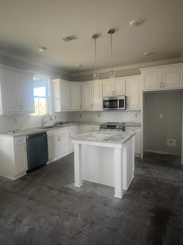 kitchen featuring appliances with stainless steel finishes, a sink, visible vents, and white cabinetry