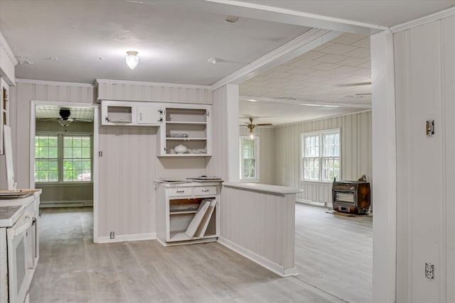 1917 Lazenby Dr, Augusta, GA 30906 - kitchen featuring a wood stove, a ceiling fan, light wood-type flooring, plenty of natural light, and ornamental molding