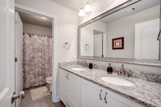 729 Houston Lake Dr, Evans, GA 30809 - full bathroom with double vanity, tile patterned floors, and curtained shower