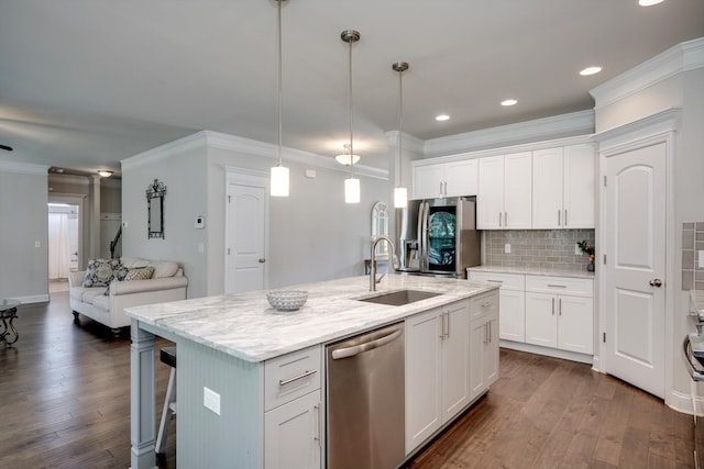 729 Houston Lake Dr, Evans, GA 30809 - kitchen with appliances with stainless steel finishes, ornamental molding, open floor plan, tasteful backsplash, and white cabinetry