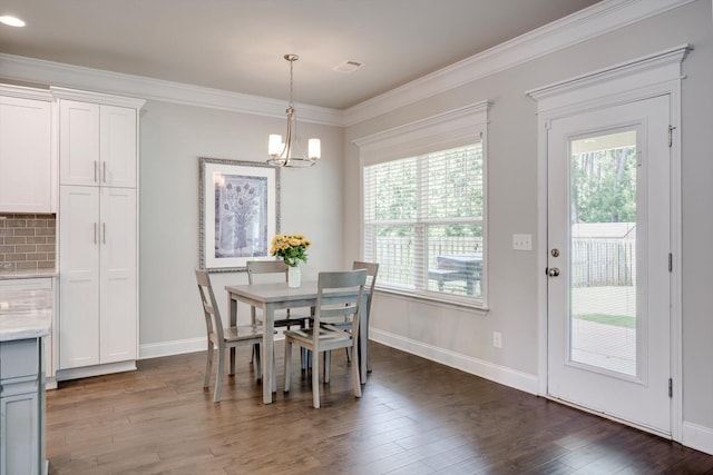 729 Houston Lake Dr, Evans, GA 30809 - dining space featuring a chandelier, dark wood finished floors, and crown molding