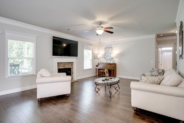 729 Houston Lake Dr, Evans, GA 30809 - living room with a ceiling fan, plenty of natural light, a stone fireplace, ornamental molding, and dark wood-type flooring