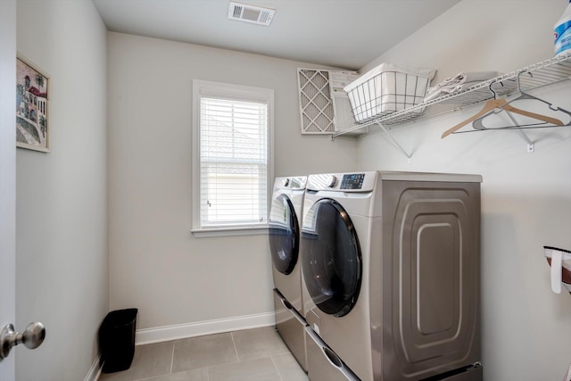 729 Houston Lake Dr, Evans, GA 30809 - laundry room featuring washer and clothes dryer and light tile patterned floors